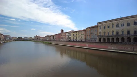 A view along the River Arno flowing through the centre of Pisa, Tuscany Video stock 157828100
