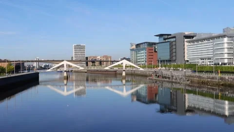 View along the River Clyde towards Tradeston Bridge and Kingston Bridge, Glasgow Stock Footage 284979089