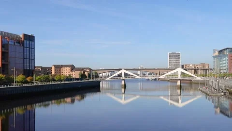 View along the River Clyde towards Tradeston Bridge and Kingston Bridge, Glasgow Stock Footage 284979105