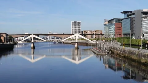 View along the River Clyde towards Tradeston Bridge and Kingston Bridge, Glasgow Stock Footage 284979106