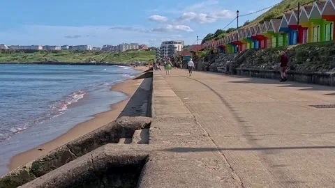 View along Scarborough seafront. Pull back shot Stock Footage 313565911