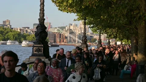 View along Southbank of The Queue of people waiting to see the Queen lying in Video stock 211877547