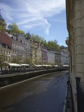 A view along the Tepla river lined with spa buildings in Karlovy Vary, Czech Rep Stock Photos