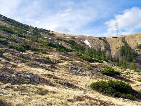 View of an alpine mountain range with remnants of snow against the sky in s.. Foto stock