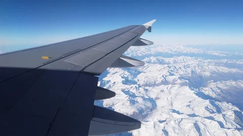 View of Alps and the plain wing from the airplane window Video stock 105456672