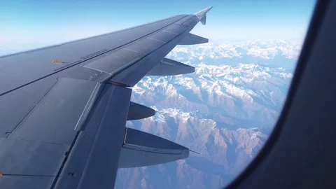 View of Alps and the plain wing from the airplane window Video stock 105456842