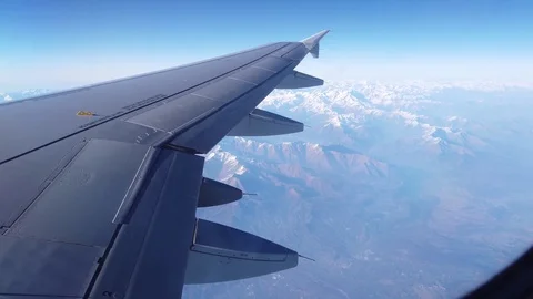 View of Alps and the plain wing from the airplane window Video stock 105456869