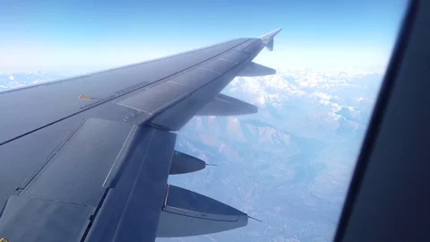 View of Alps and the plain wing from the airplane window Video stock 105456879