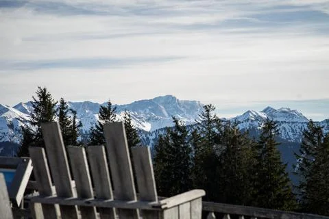 View into the alps seen from a bench Stock Photos