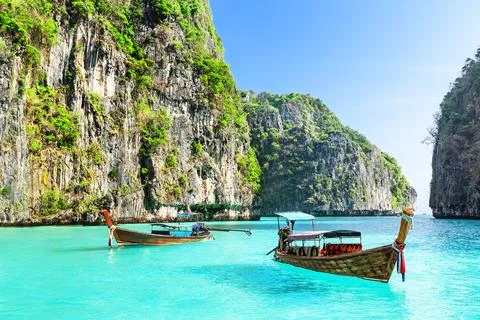 View of amazing landscape with two longtail boats of Loh Samah Bay on Phi P.. Stock Photos