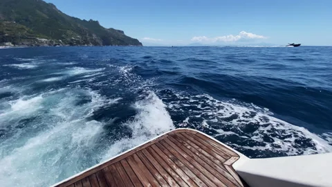 View on amazing seascape from the back deck of riding motorboat, water splashes 動画素材 345479007