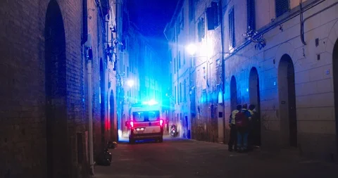 View of ambulance car driving on the narrow street at night. Emergency truck in Stock Footage 112763003