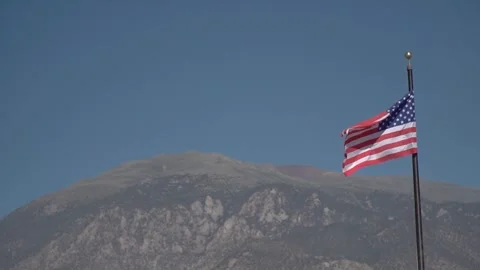 View of American flag on blue building background Stock Footage 254545125