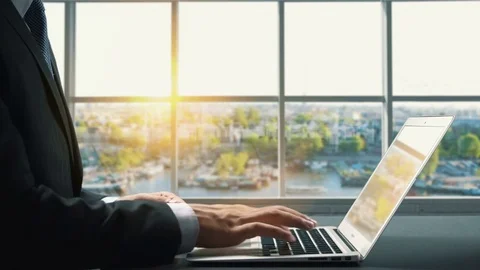 View of Amsterdam Netherlands .Close up hand Businessman using laptop Stock Footage 83735536