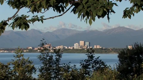 A view of Anchorage with the Chugach Mountains behind it. Stock Footage 79178584