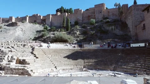 View of the ancient Roman amphitheater and the Alcazaba fortress in Malaga Stock Footage 258786459