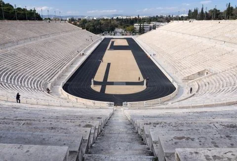 View of the ancient stadium of the first Olympic Games in white marble Stock Photos