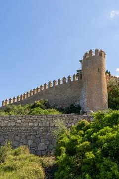 View of ancient stone wall in old town of Arta, Mallorca, Spain. Historic f.. Stock Photos