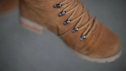 View and scene on brown women's shoes on a female foot Stock-Footage 129734845