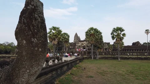 View of Angkor Wat temple , in the distance visible walking tourists. Cambodia. Stock Footage 105878074