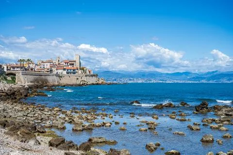 View to Antibes from the beach with reflections Stock Photos