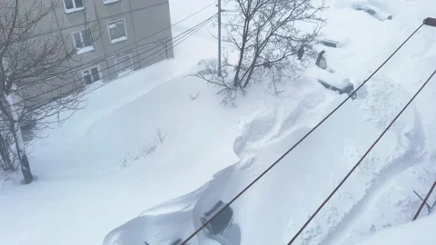 View from the apartment window to the courtyard during a snowstorm Stock Footage 263006459