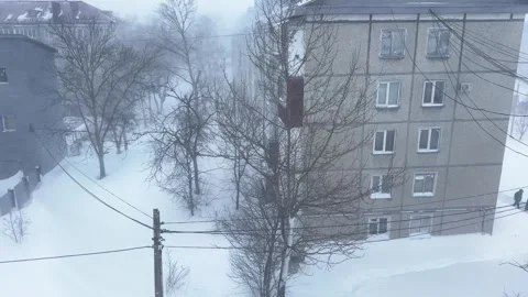 View from the apartment window to the courtyard during a snowstorm Stock Footage 263006481