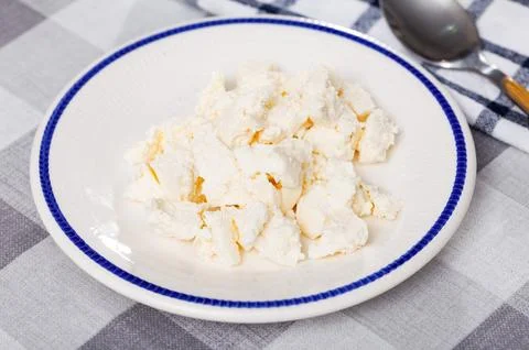 View of appetizing young cheese on plate Stock Photos