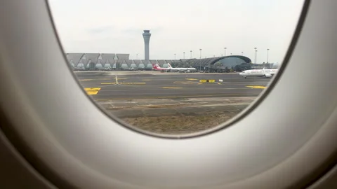 View of apron, control tower, tarmac and aircrafts from porthole Stock Footage 301527020