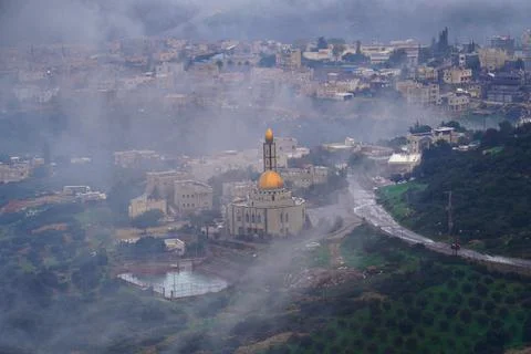 View of Arab village through clouds Stock Photos