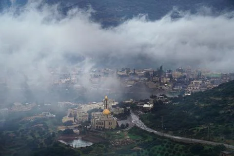View of Arab village through clouds Stock Photos