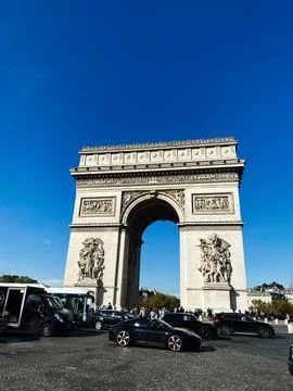 View of the Arc de Triomphe under a clear blue sky in Paris, France Stock Photos