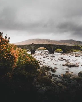 View of arch bridge crossing a river in Scottish Highlands, Scotland Stock Photos