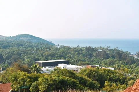 A view of a architecture in between a forest on top of a hill in India Stock Photos