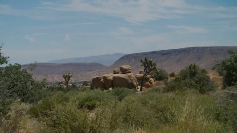 View of arid desert and mountain plateau in the region above Yucca Valley Stock Footage 113298910
