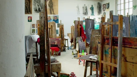 View in art studio with many easels. Shot on RED Stock Footage 105066536