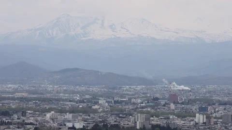 View of Asahikawa cityscape with mountains in the background, Japan. Video stock 343679995