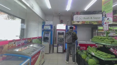 View of Asian man waiting queue at the atm in a convenience store Video stock 221181271