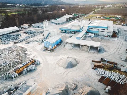 A view of asphalt construction storage base, dusty from all the gravel and sand Stock Photos