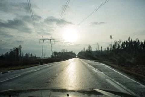 View of the asphalt road through the windshield of the car. Stock Photos