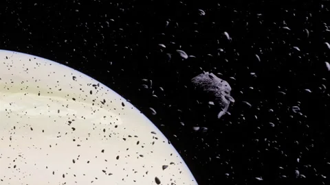 View of asteroid field near a giant planet with rings Stock Footage 343544905