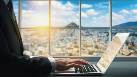 View of Athens Greece. Close up hand Businessman using laptop Stock Footage 83735796
