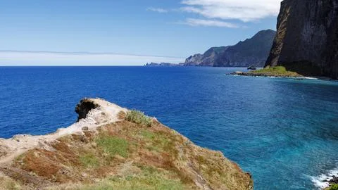 View of the Atlantic Ocean and high cliffs from the Miradouro do Guindaste .. Stock Photos