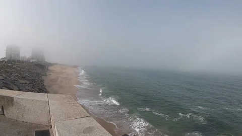 View of the Atlantic Ocean. Empty beach in Povoa de Varzim, Portugal on foggy Video stock 113824174