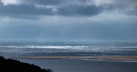 View of the Atlantic ocean with stormclouds and swirl patterns under a dra... Stock Photos