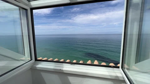 View of the Atlantic Ocean through the window, Portugal Stock Footage 250113611