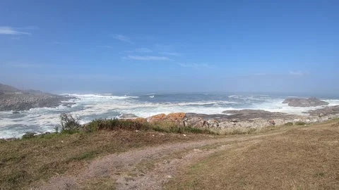 View of the Atlantic Ocean. On the way to Oia, Spain on a sunny day with waves Stock Footage 114583563