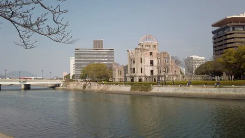 View of the Atomic Bomb Dome along the river in Hiroshima, Japan Stock Footage 124502809