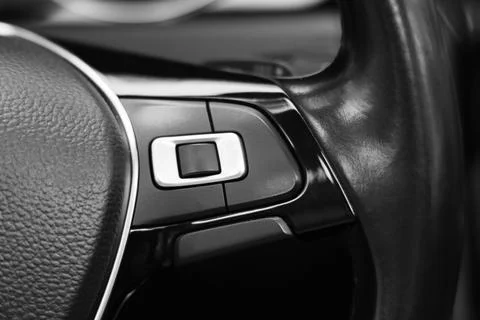 View of audio control panel on steering wheel in modern car, closeup Stock Photos