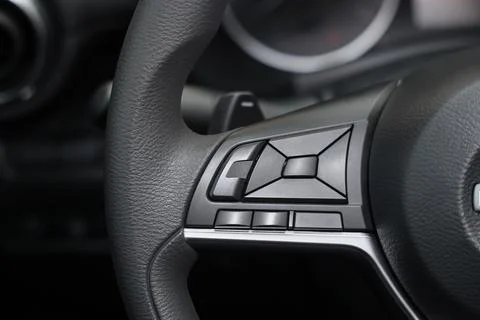 View of audio control panel on steering wheel in modern car, closeup Stock Photos